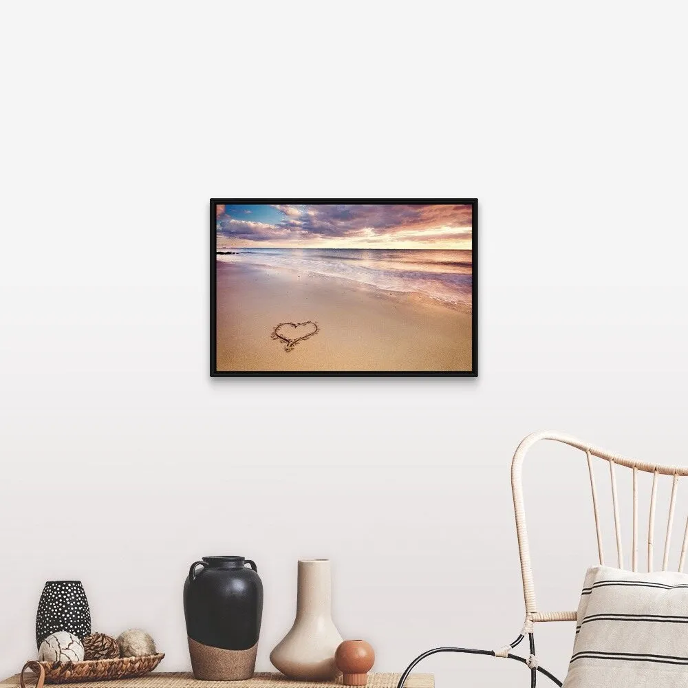 "A heart in the sand on a dutch beach during sunset." Black Float Frame Canvas Art