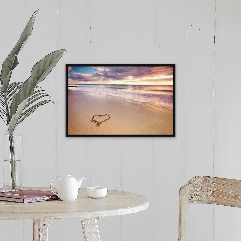 "A heart in the sand on a dutch beach during sunset." Black Float Frame Canvas Art