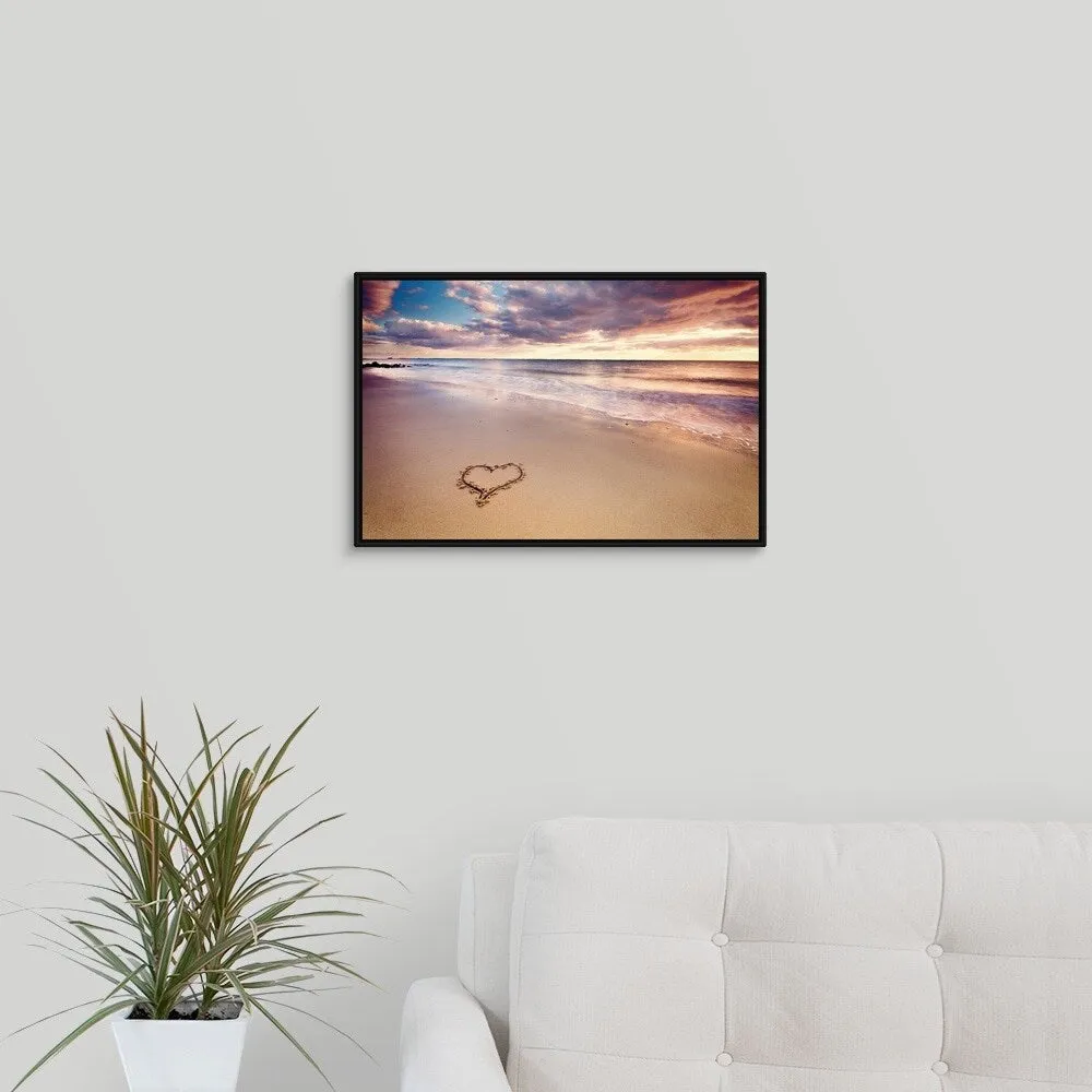 "A heart in the sand on a dutch beach during sunset." Black Float Frame Canvas Art