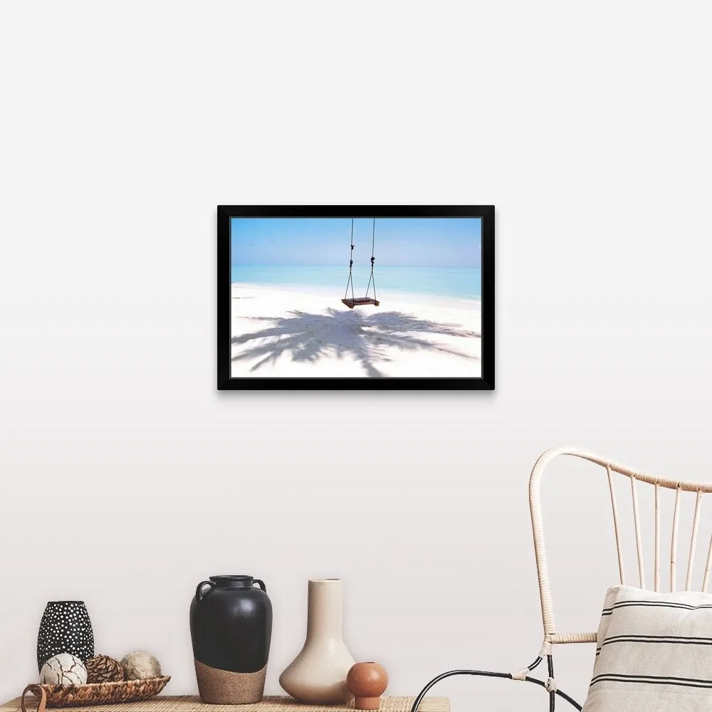 "Beach swing and shadow of palm tree on sand" Black Framed Print